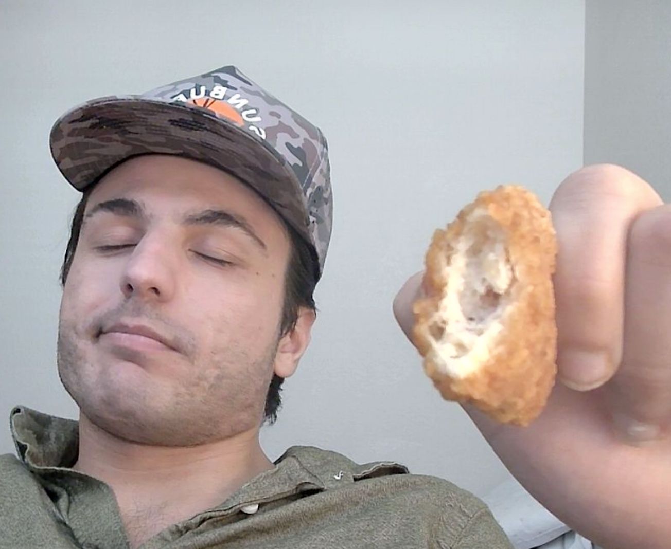 $DOOCHIE token art — man holding bitten chicken tender